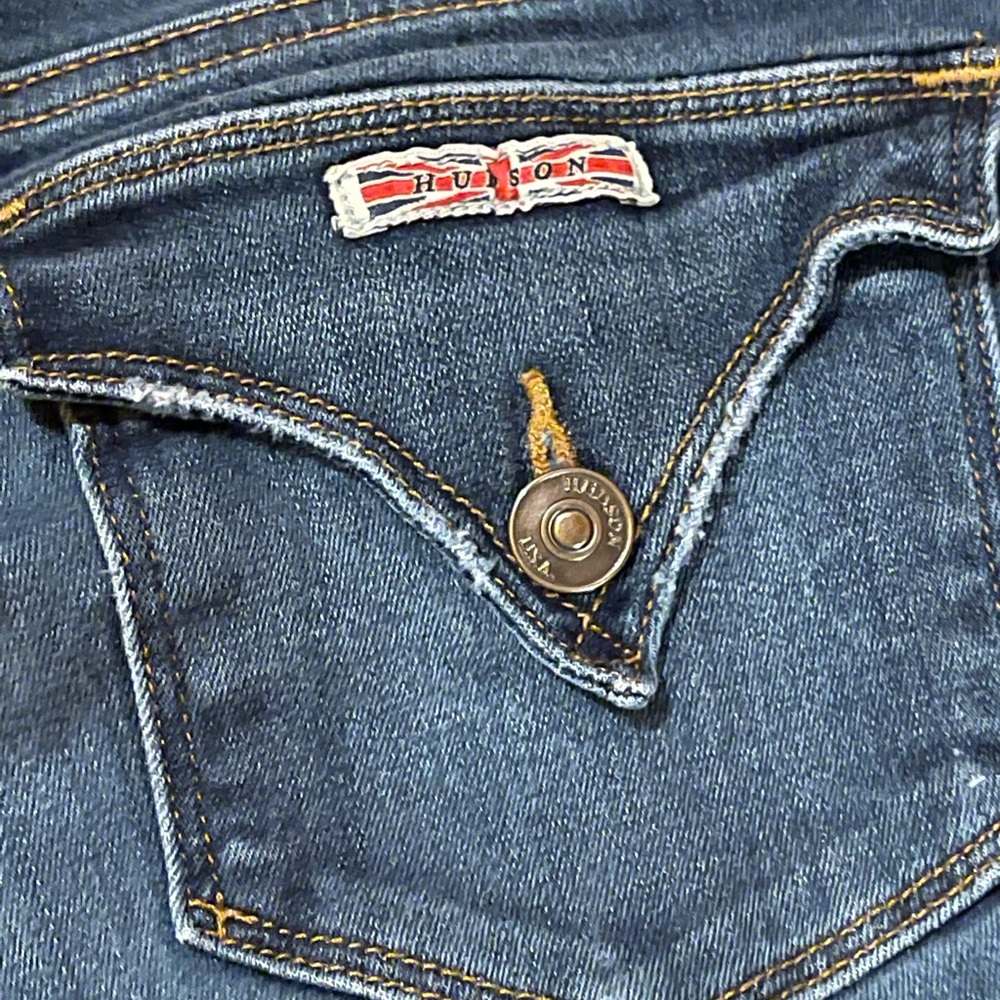 Hudson dark washed with cute pointed flap back pockets! Good condition.